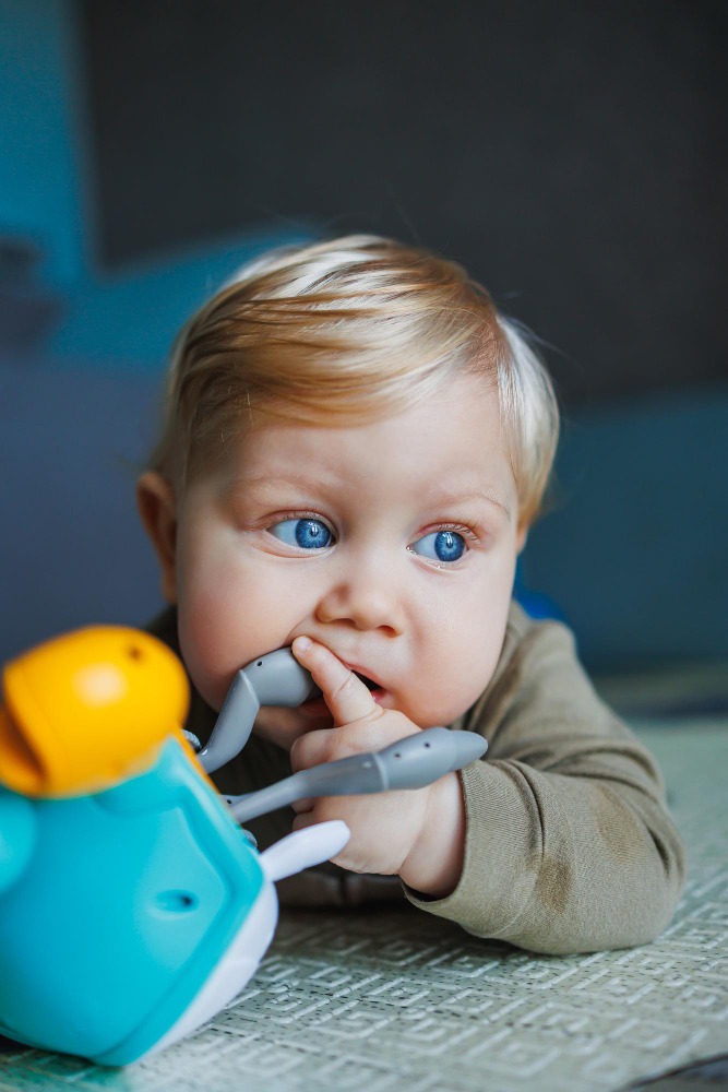 a child playing with a toy relating to a product recall and defective products