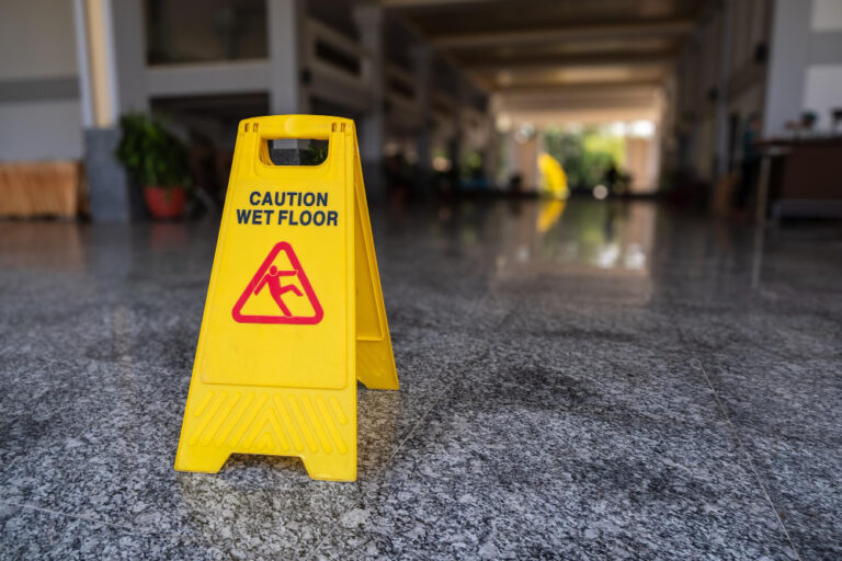 a wet floor sign designed to precent slip and fall accidents