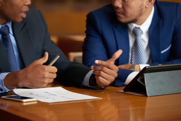 closeup of two men speaking about a personal injury case and seeking legal help