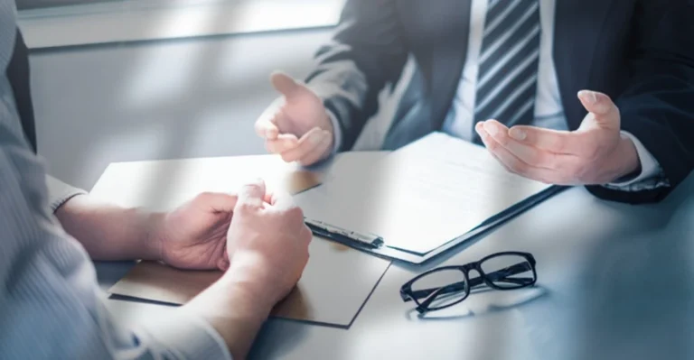 Individual discussing settlement terms directly with insurance representative while negotiating their own pain and suffering claim